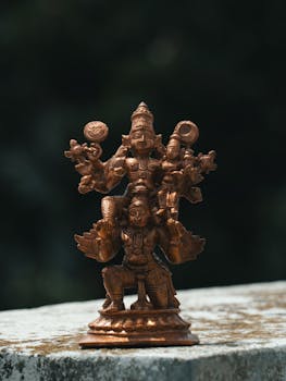 Detailed brass sculpture of a Hindu god in Bengaluru, showcasing exquisite craftsmanship.