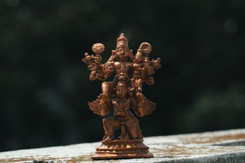 Free Close-up of a handcrafted bronze Hindu deity statue showcasing exquisite detail and artistic craftsmanship. Stock Photo