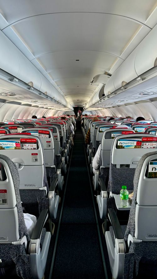 Free View inside a commercial airplane with empty seats neatly arranged. Modern travel. Stock Photo