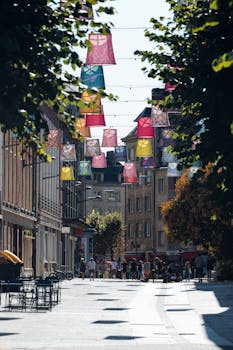 Charming street in Amiens decorated with vibrant lanterns, creating an inviting atmosphere.