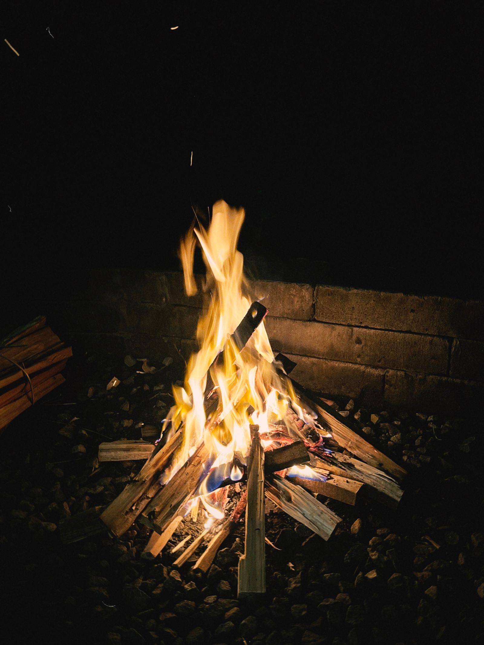 Stacked Wood Campfire 4K wallpaper