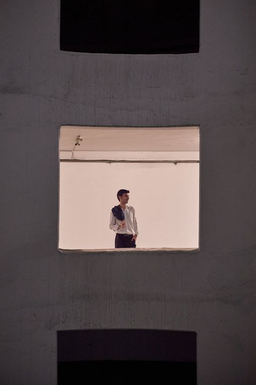 Free Stylish male model posing indoors in a minimalist setting in Istanbul. Stock Photo