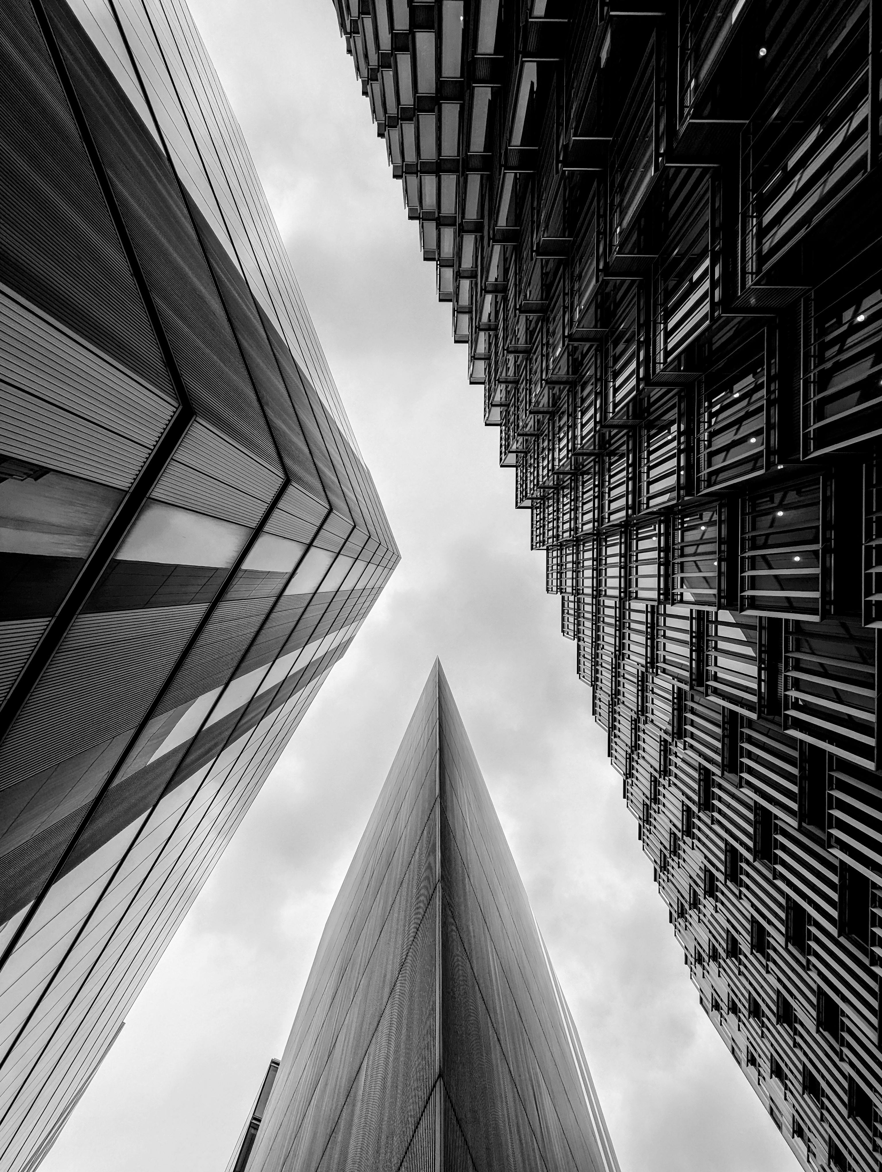 A black and white capture of modern skyscrapers in London forming a dramatic urban landscape.