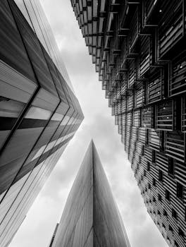 A black and white capture of modern skyscrapers in London forming a dramatic urban landscape.