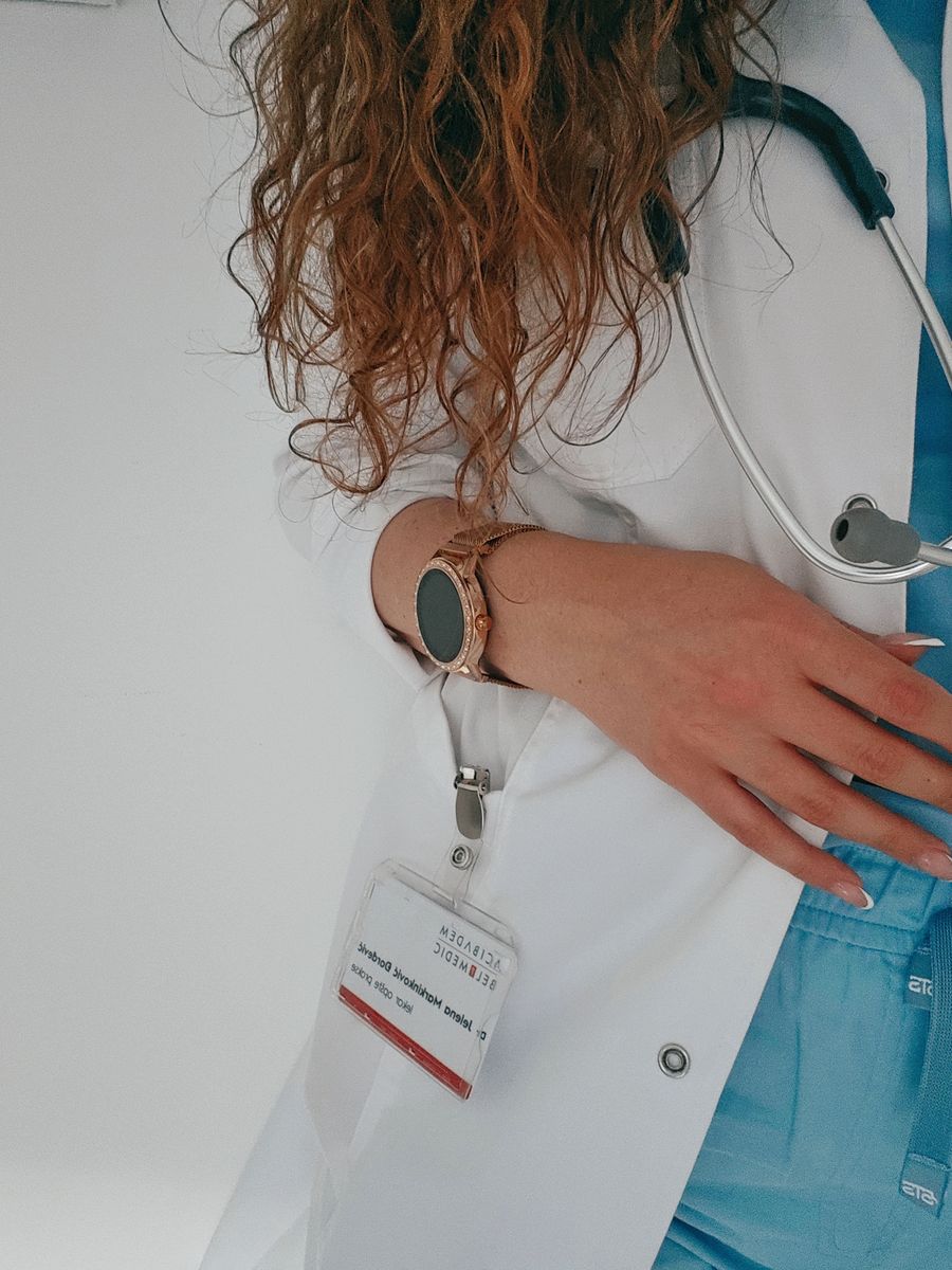 Female medical professional wearing ceil blue scrubs