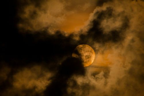 Moon shining through dark cloudy sky · Free Stock Photo