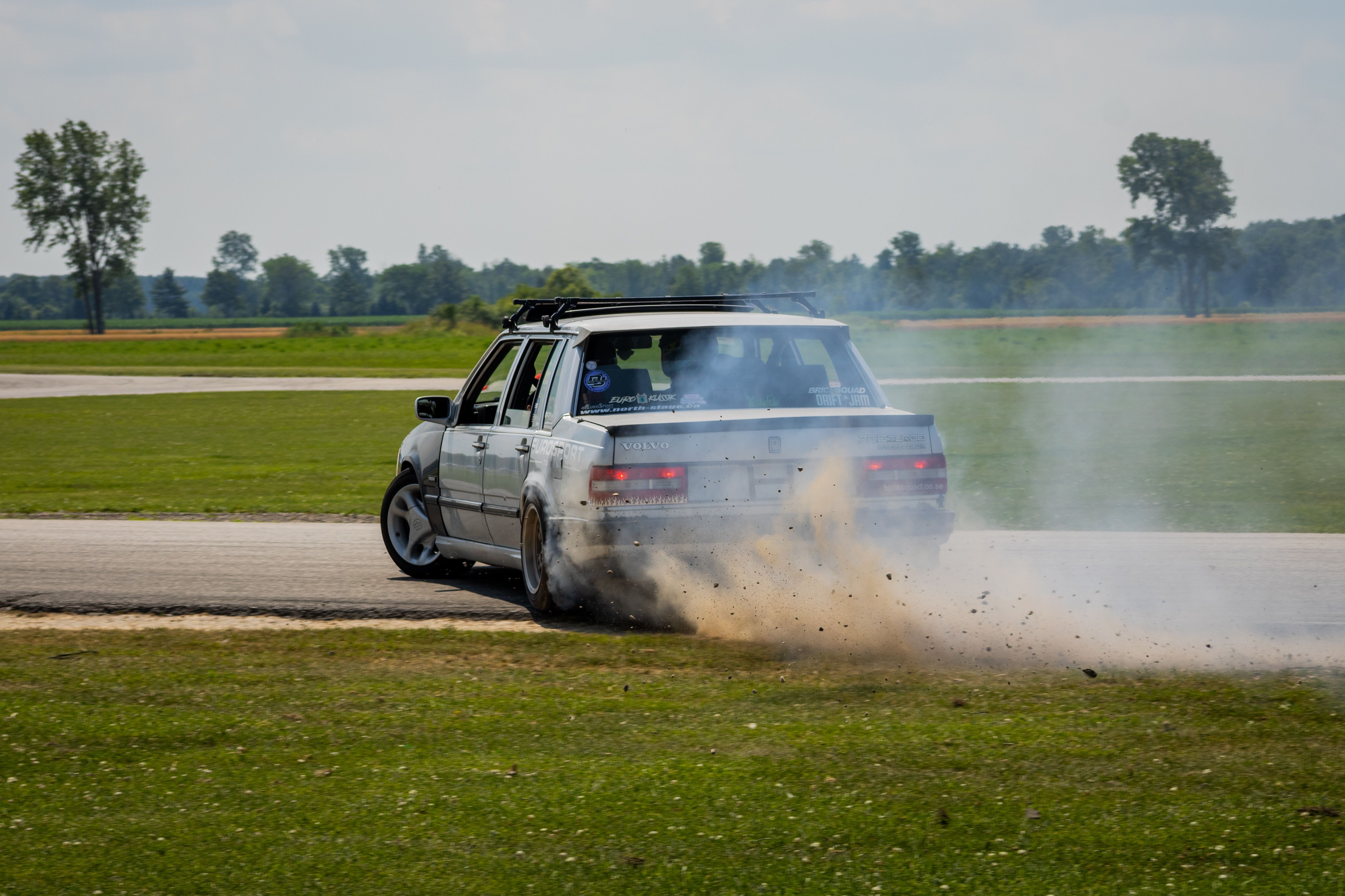 Dynamic Car Drifting on Race Track with Smoke · Free Stock Photo