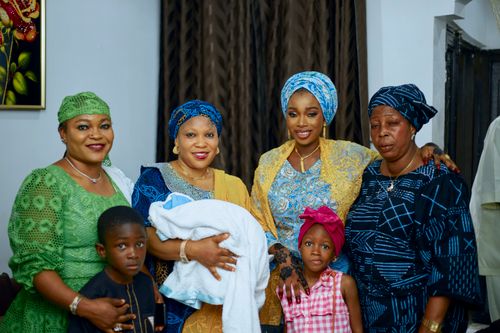 Free A joyful family gathering showcasing vibrant traditional clothing and cultural heritage. Stock Photo