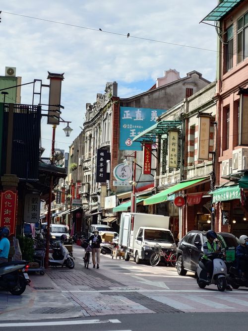 Free Vibrant urban street scene with shops, signs, and people in Asia, capturing the hustle and bustle. Stock Photo