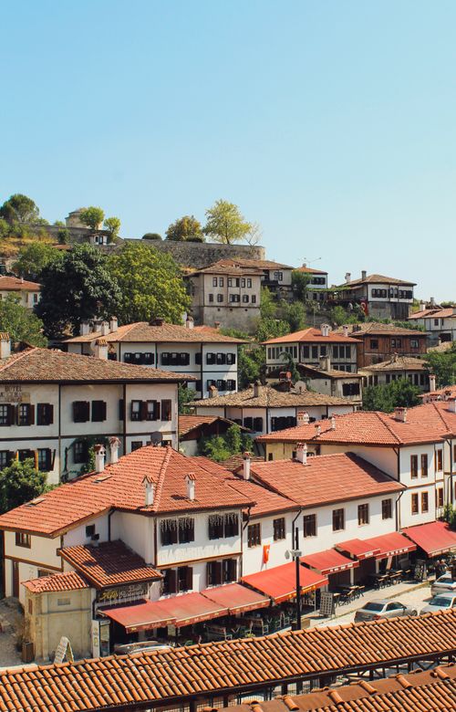 Free Scenic view of historical Ottoman-style houses with red roofs in a Turkish village. Stock Photo