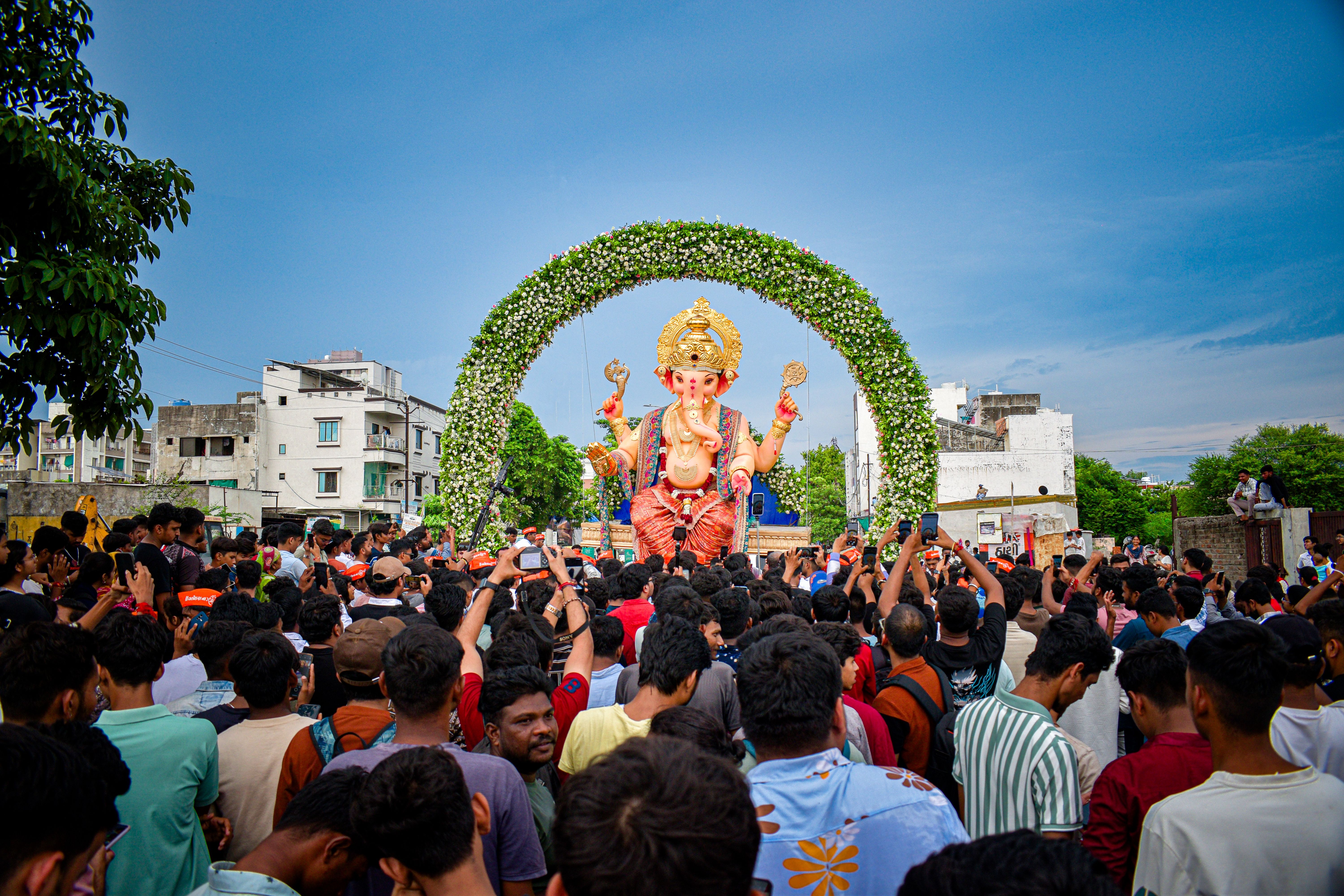 Lively Ganesh Chaturthi festival with a large crowd in Vadodara, Gujarat, India.
