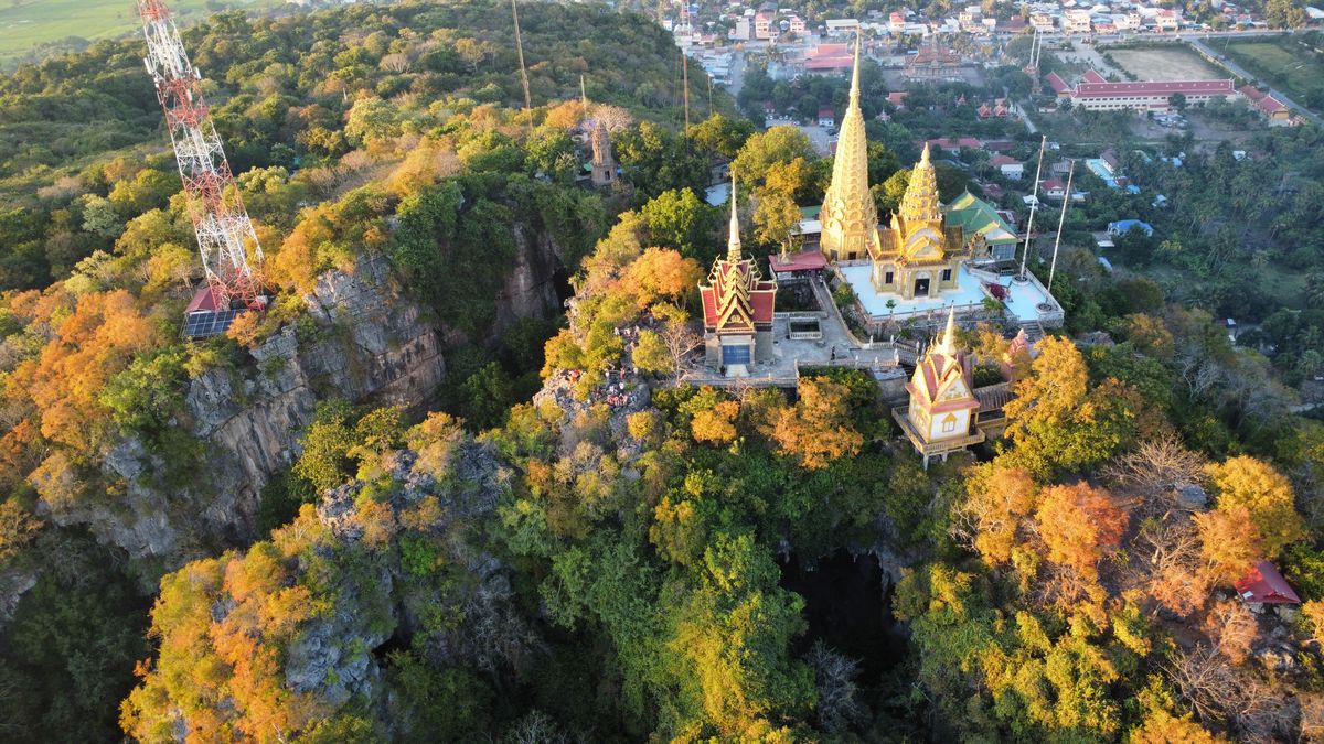 Aerial view of Wat Banan hilltop temple amid green Battambang countryside