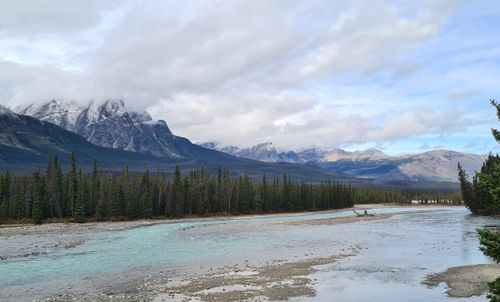 Free Scenic landscape of the Canadian Rockies with a turquoise river and evergreen forests. Stock Photo