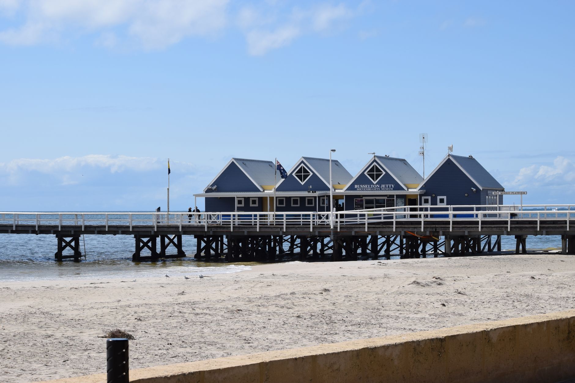 Scenic view of the iconic Busselton Jetty extending over the beach in Western Australia.