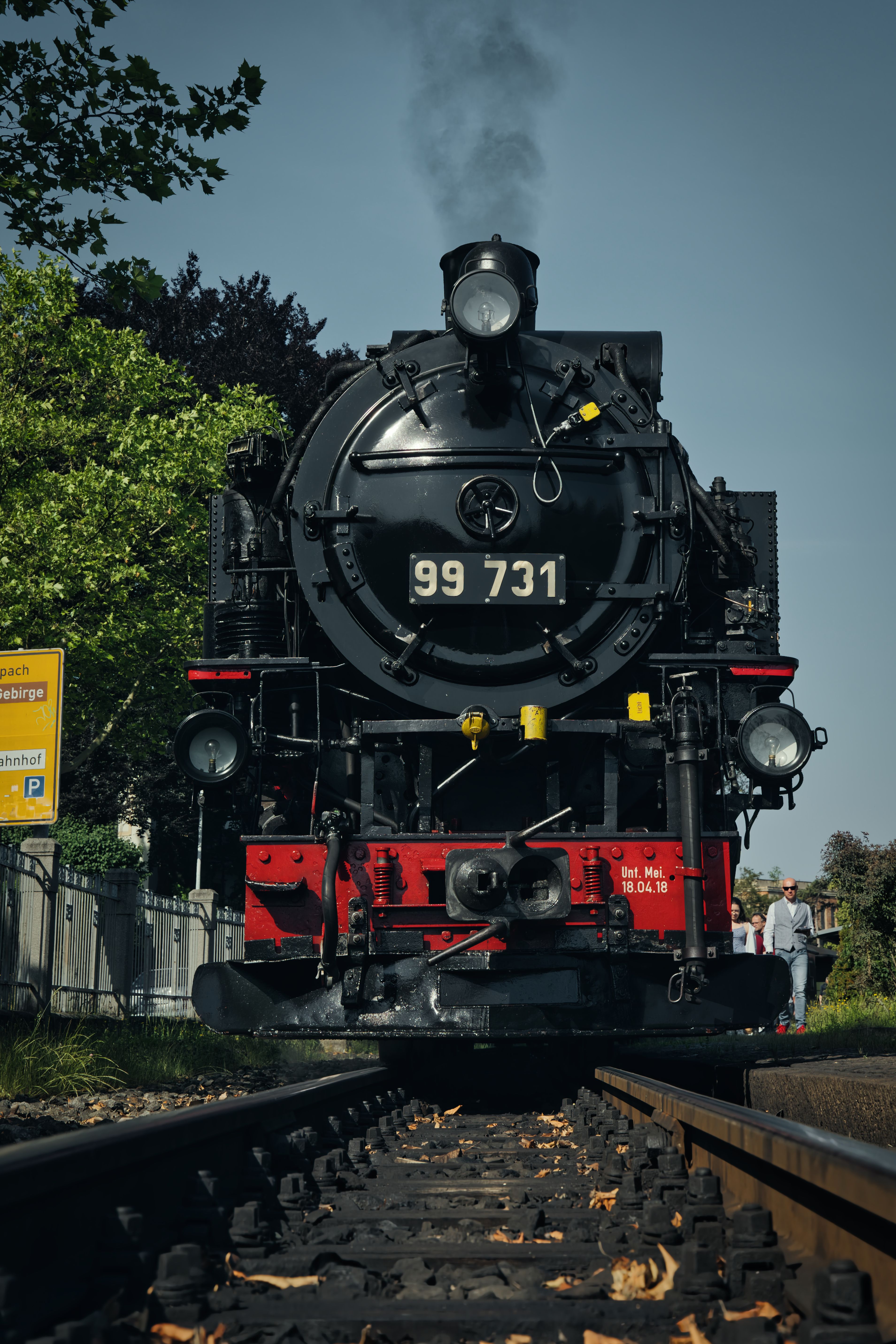 Front view of a vintage steam train on tracks in Zittau, Saxony, Germany.