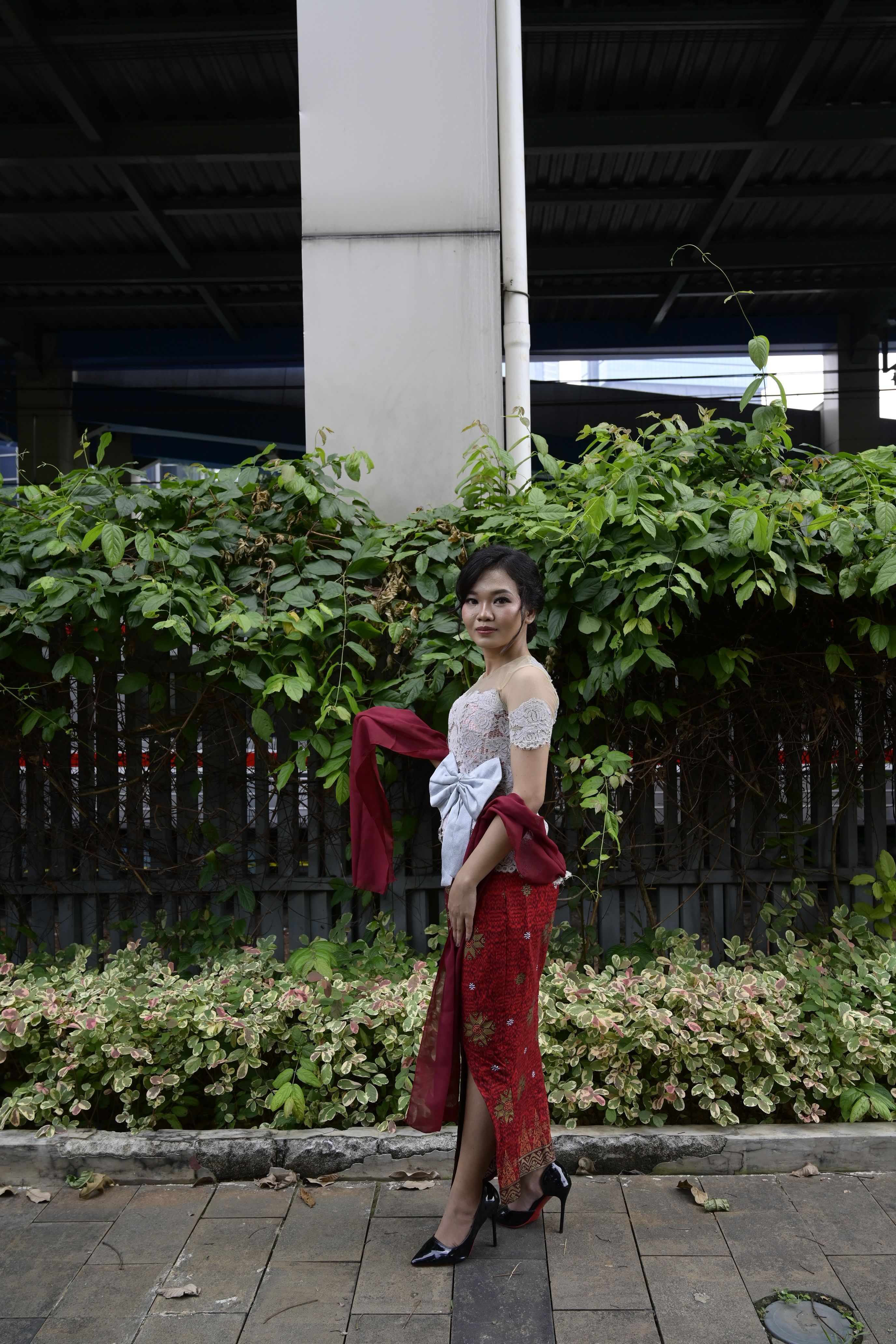 Elegant Woman Posing in Traditional Dress Outdoors