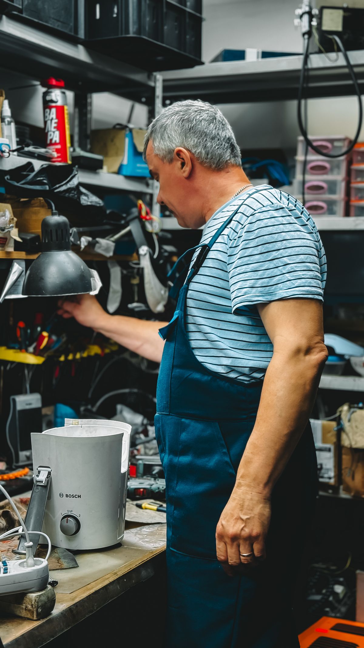 Technician repairing a wine cooler for an extended warranty guide