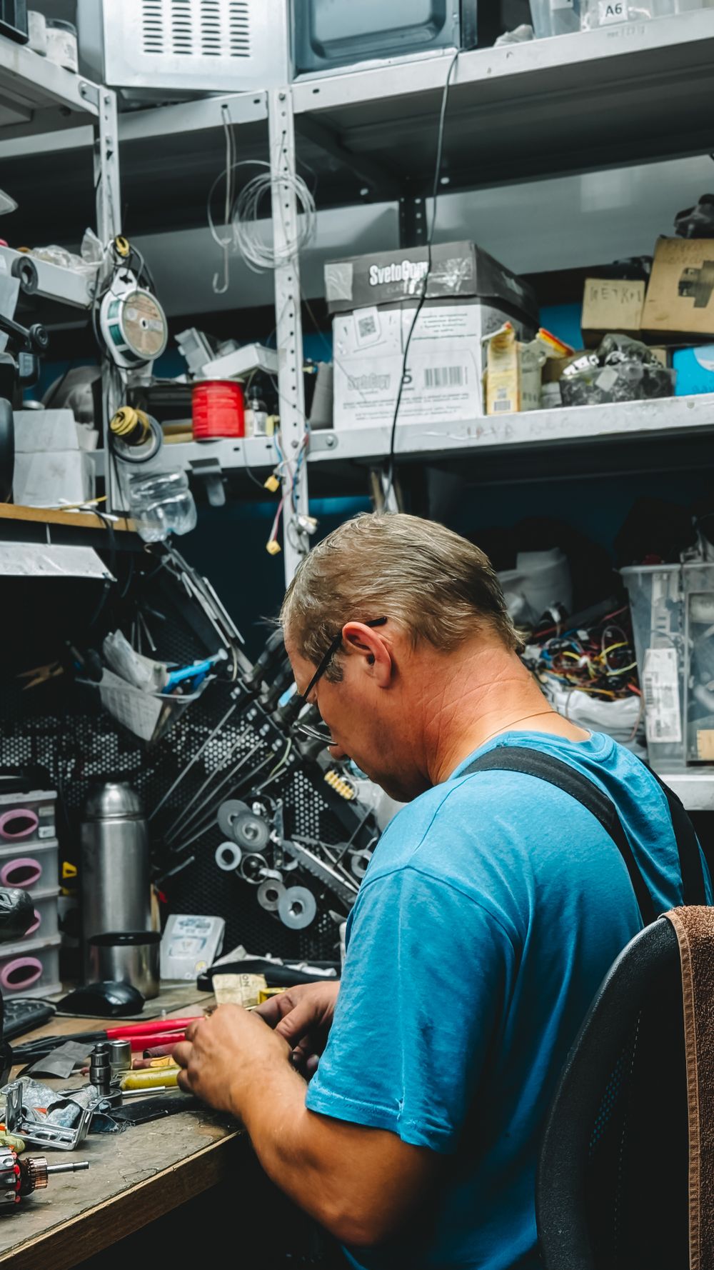 Workbench at Samriddhi Electronics and Automation surrounded by repair tools and test equipment