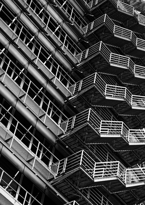 Free Monochrome view of a modern building facade with geometric patterns in Amsterdam. Stock Photo