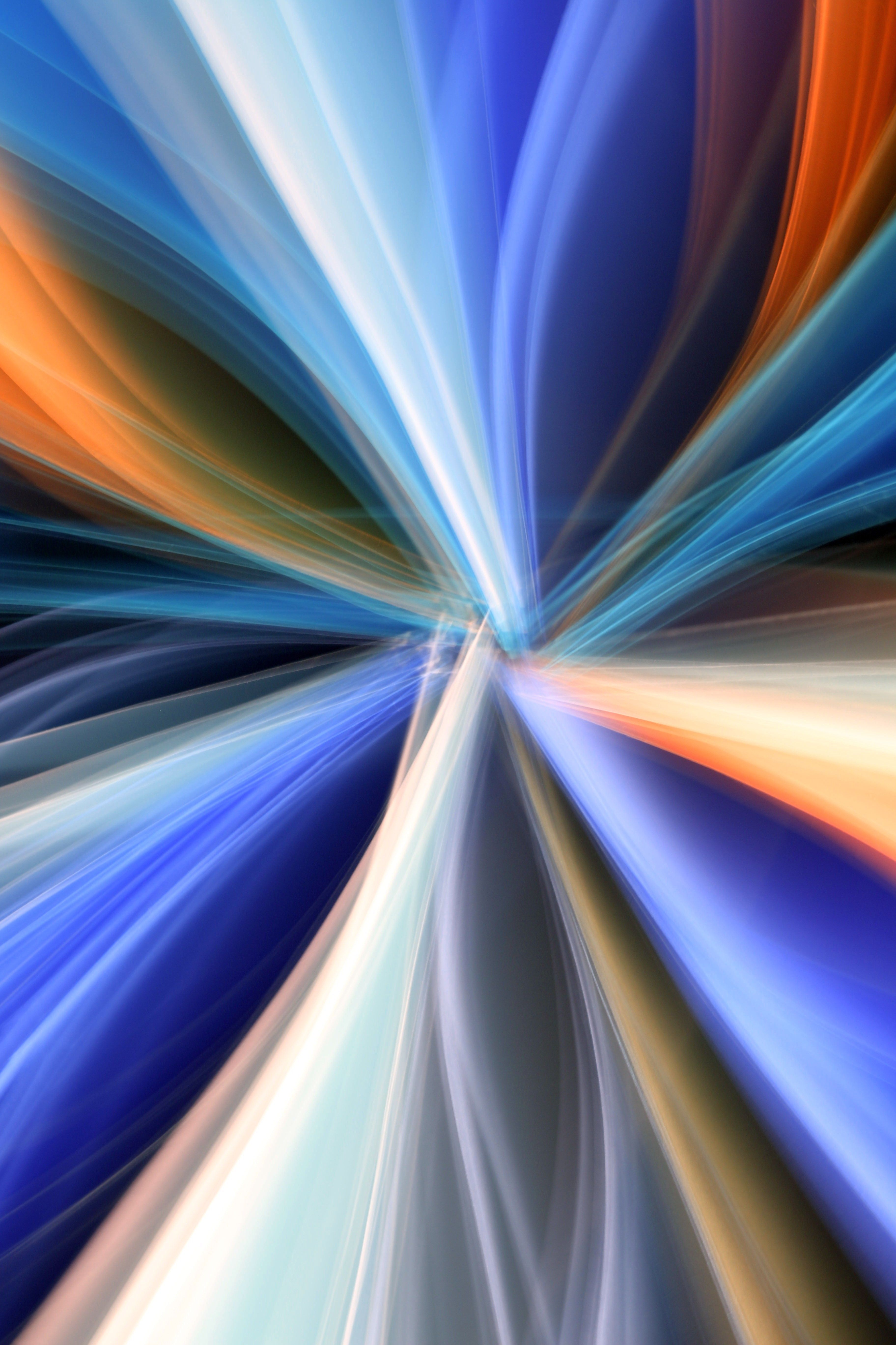 Dynamic abstract image with colorful light streaks creating a vibrant and energetic pattern.