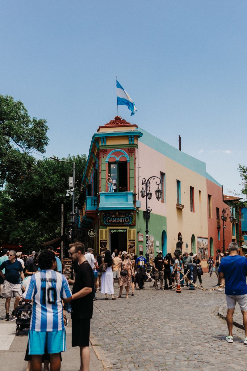 Colourful Caminito street corner with an Argentine flag in La Boca, Buenos Aires