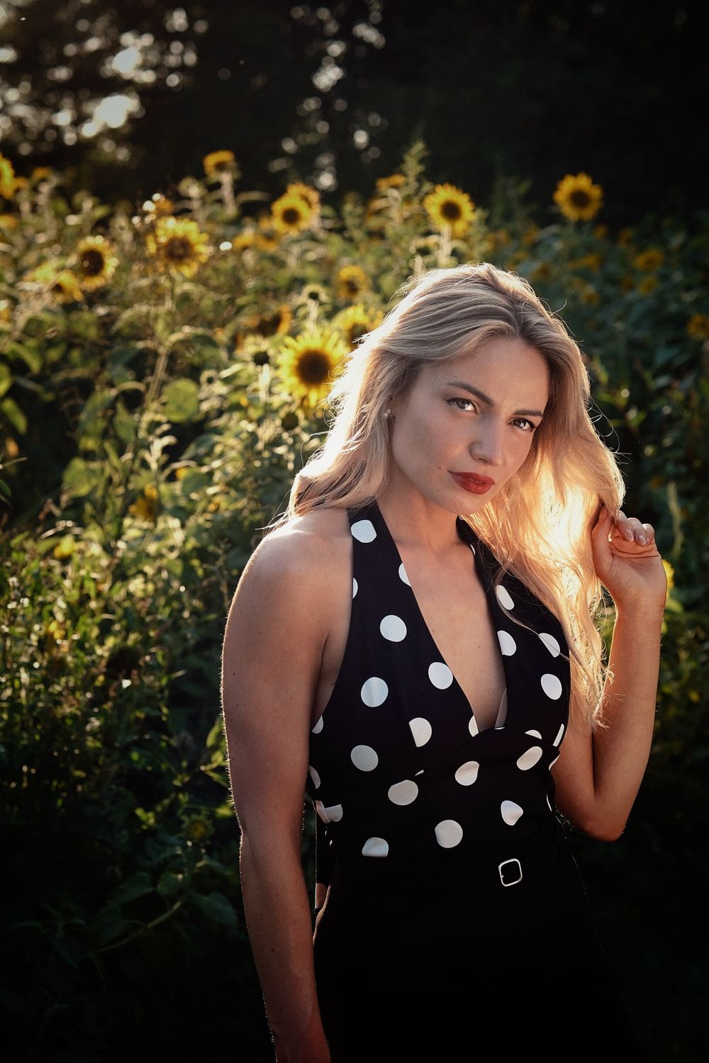 Woman in Polka Dot Dress in Sunflower Field · Free Stock Photo