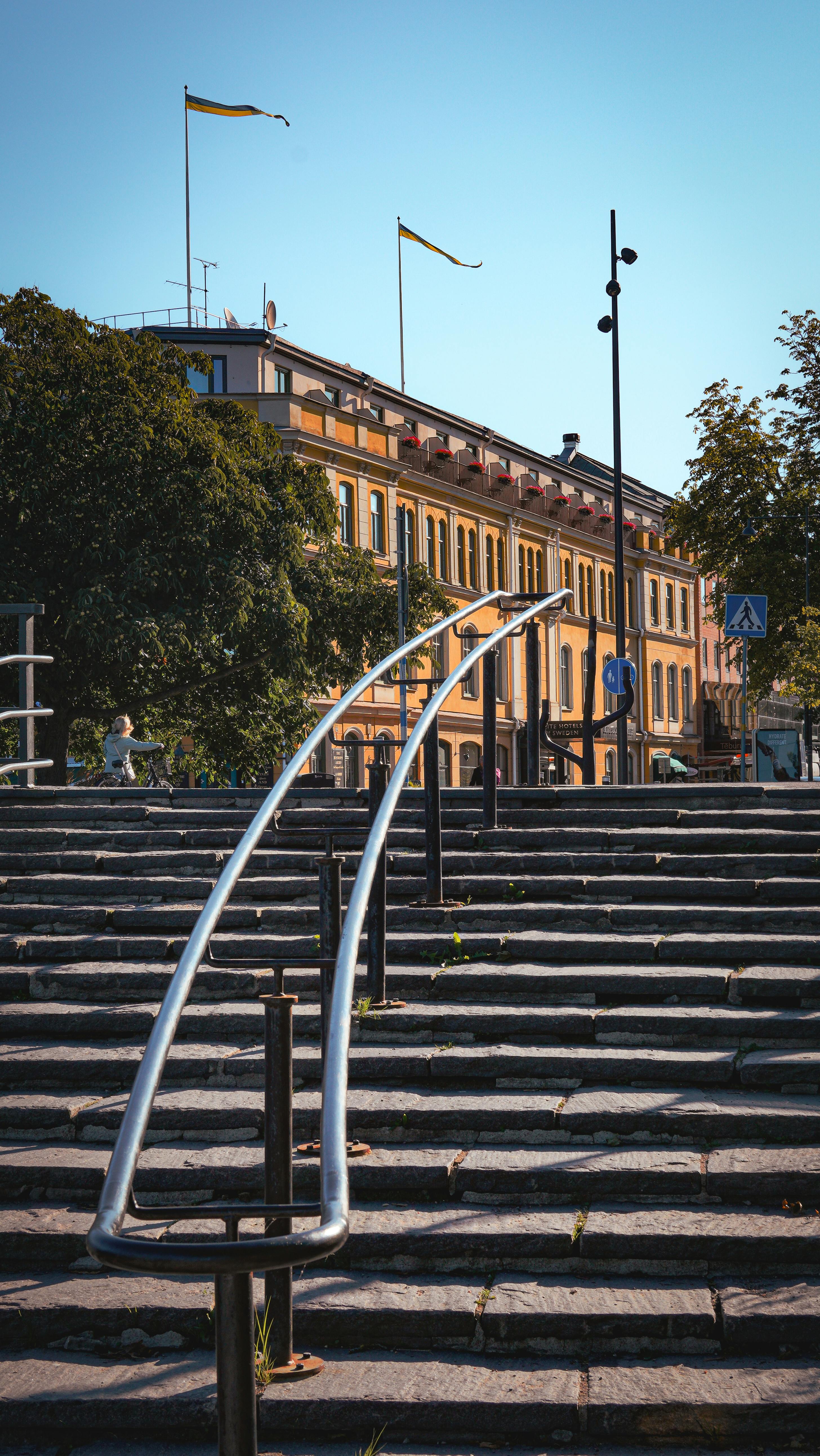 Charming historic architecture with steps in Kalmar, Sweden under a clear blue sky.