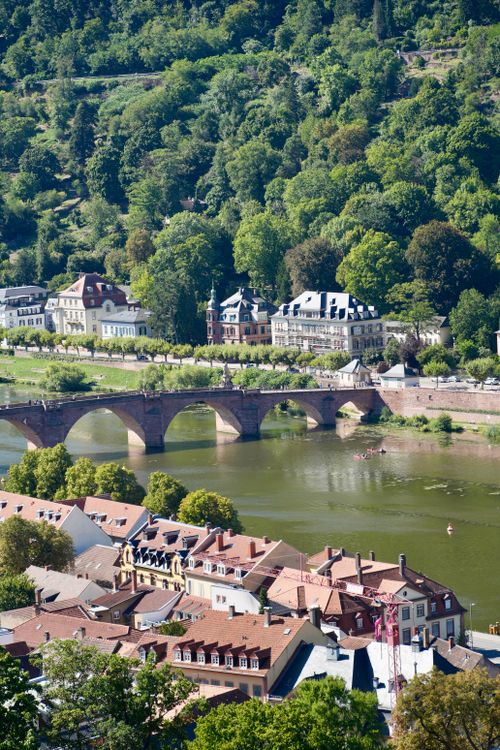 Free A picturesque view of Heidelberg, Germany featuring the Neckar River and historic architecture. Stock Photo