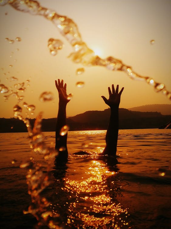 Free Hands Above Water Stock Photo