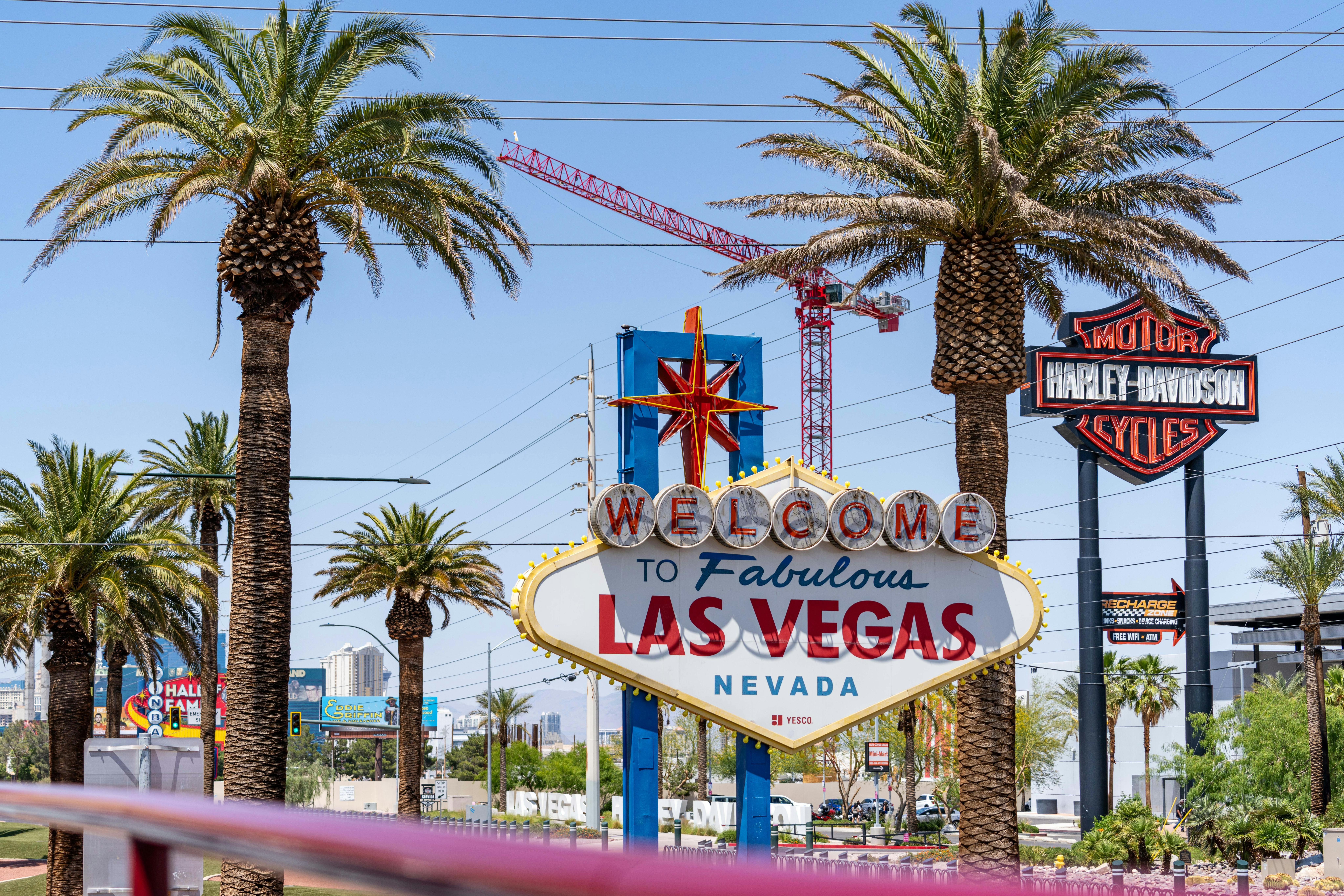 Famous Welcome to Las Vegas sign with palm trees and bright skies, capturing the essence of Nevada's charm.