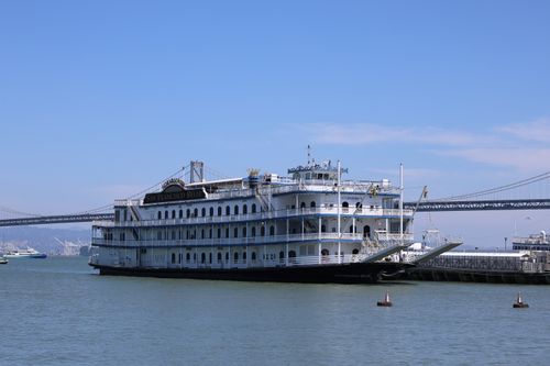 Free San Francisco Belle riverboat docked by the Bay Bridge on a sunny day in California. Stock Photo