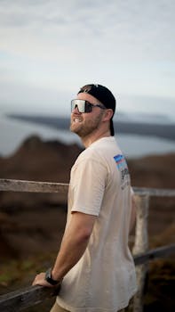 A man enjoys the scenic Galapagos landscape, showcasing outdoor exploration.
