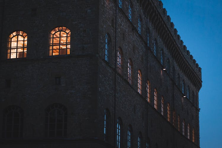 Facade Of Brick Apartment Building At Night