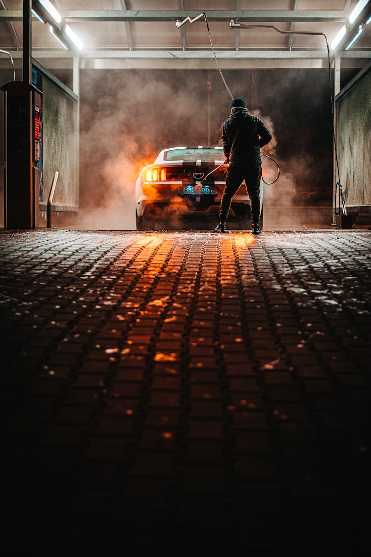 Car Being Wash By Man