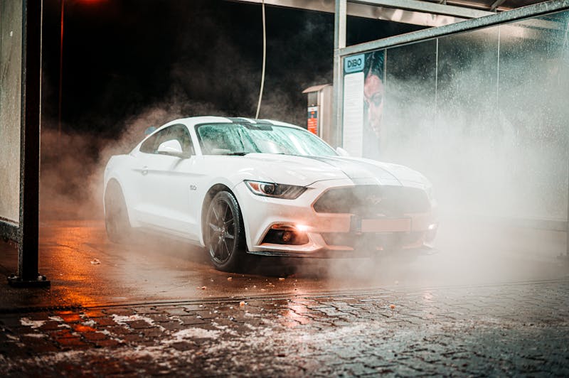 Car being washed in car wash facility
