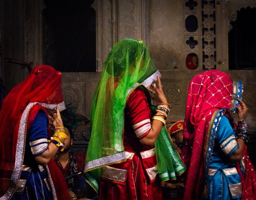 Free Traditional Rajasthani dancers in colorful attire performing a folk dance in Udaipur, India. Stock Photo