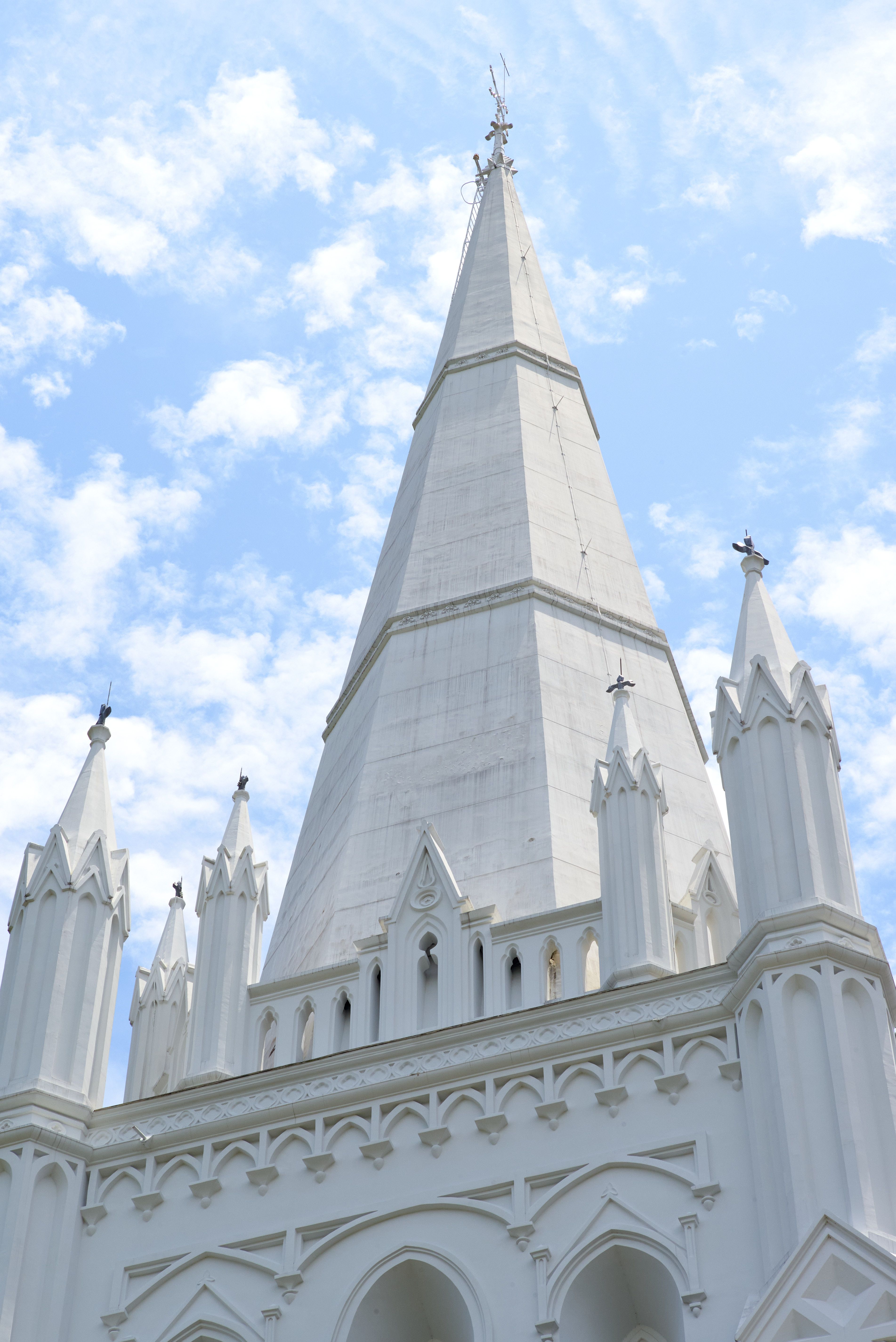 Stunning Gothic Cathedral Spire Against Blue Sky · Free Stock Photo