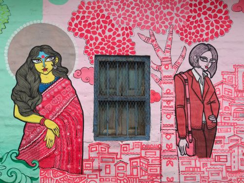 Free Colorful street art depicting characters on a wall in Kolkata, India. Stock Photo
