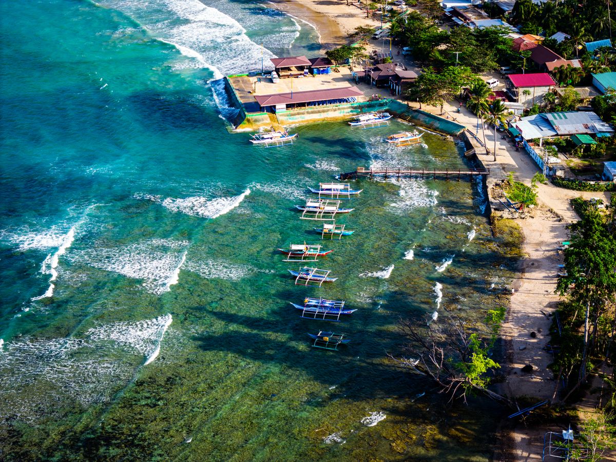 Aerial view of Siargao's coast and boats