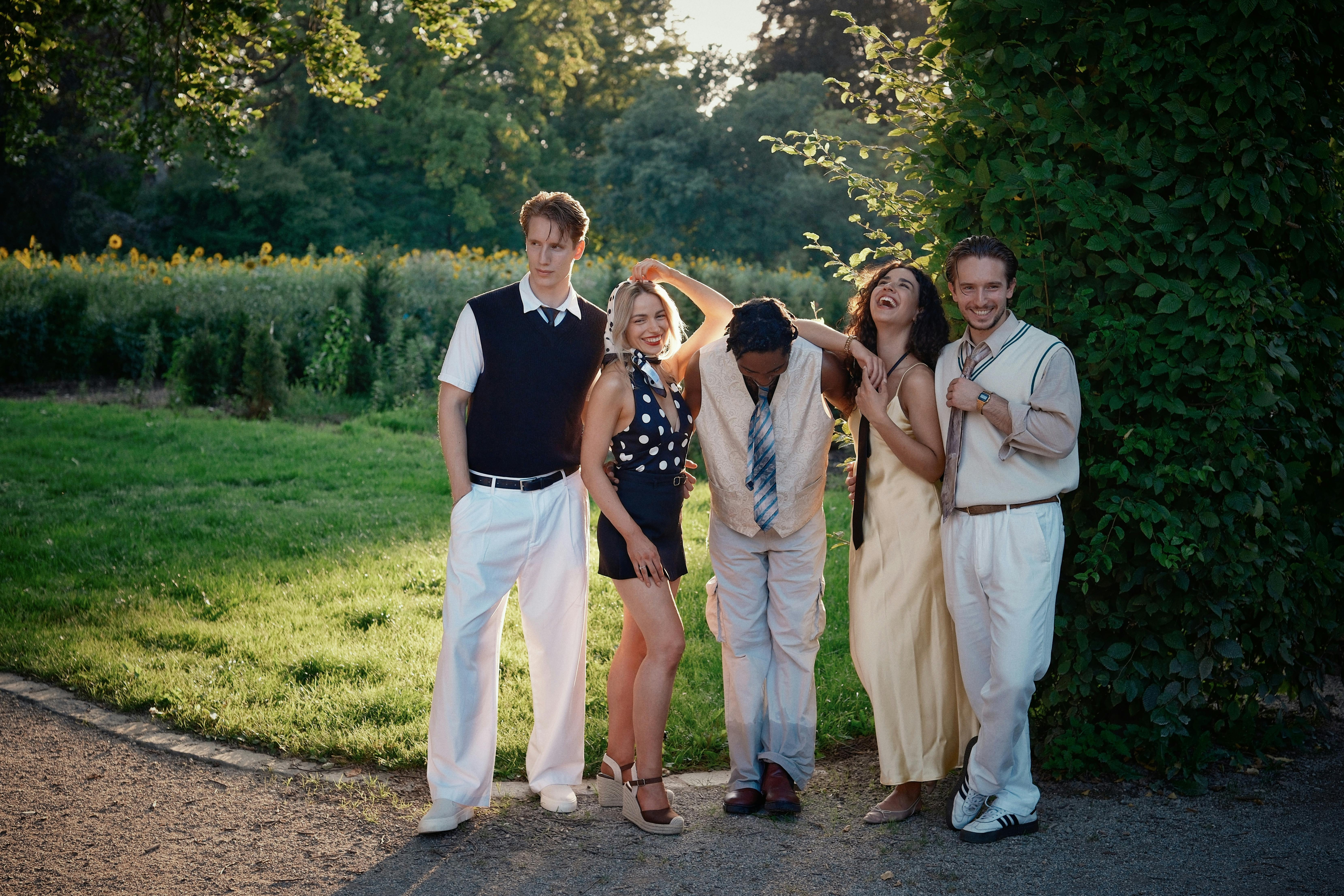 A cheerful group of adults enjoying a sunny day outdoors, capturing the essence of friendship.