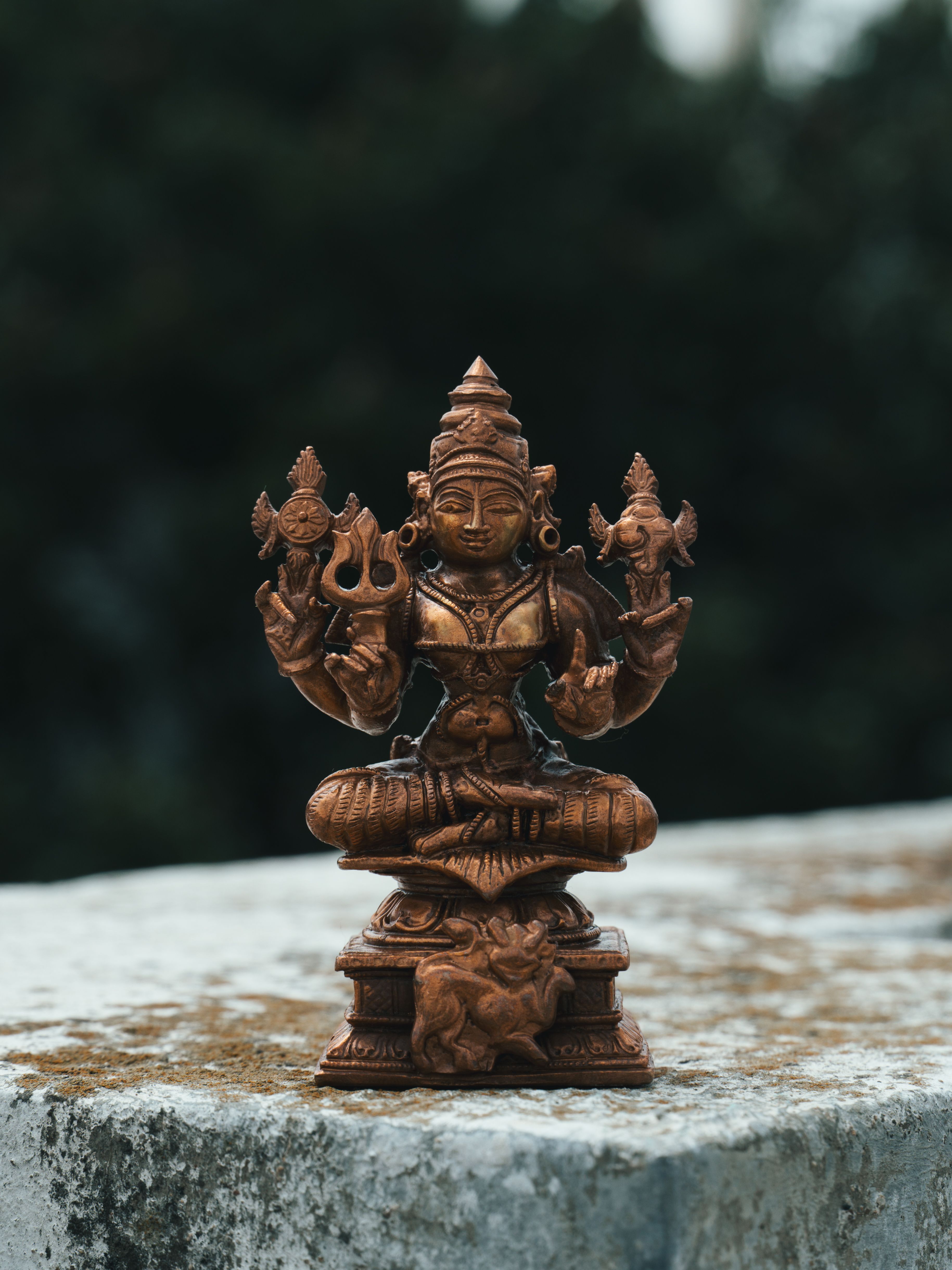 Close-up of a detailed Hindu deity bronze statue in Bengaluru, showcasing fine artisanal craftsmanship.