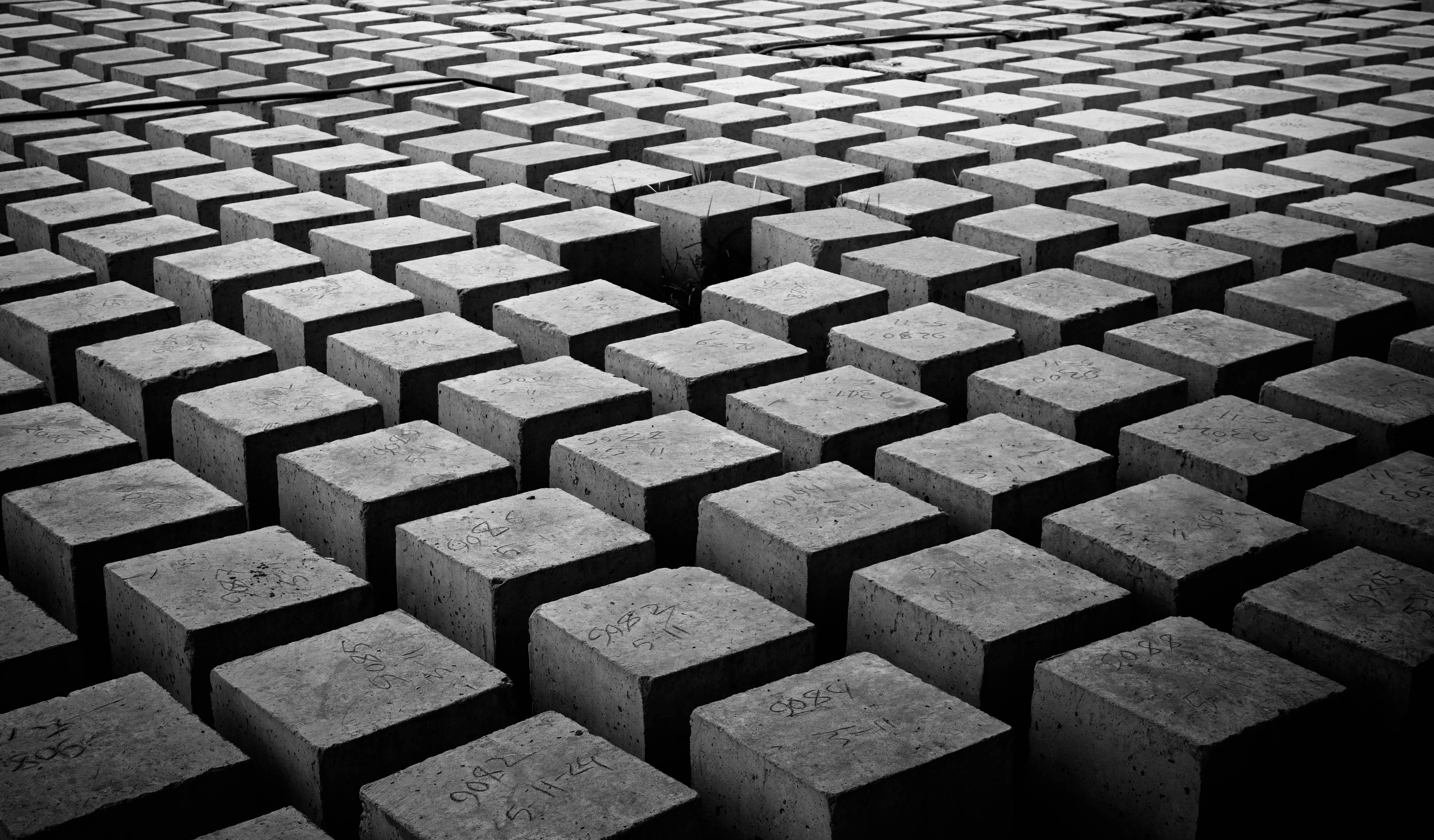 Aerial view of organized concrete blocks creating an abstract architectural pattern in Dhaka, Bangladesh.