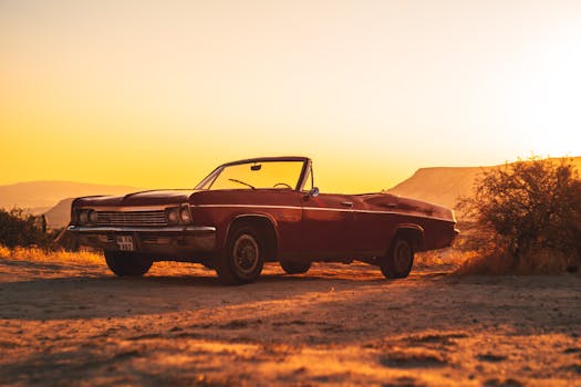 A classic convertible car parked outdoors during a picturesque sunset in Türkiye.