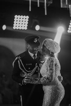 A couple shares an intimate dance during their wedding in stunning black and white.