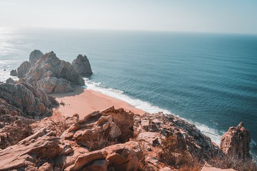 Free Breathtaking ocean view from rocky cliffs in Cabo San Lucas, Mexico. Stock Photo