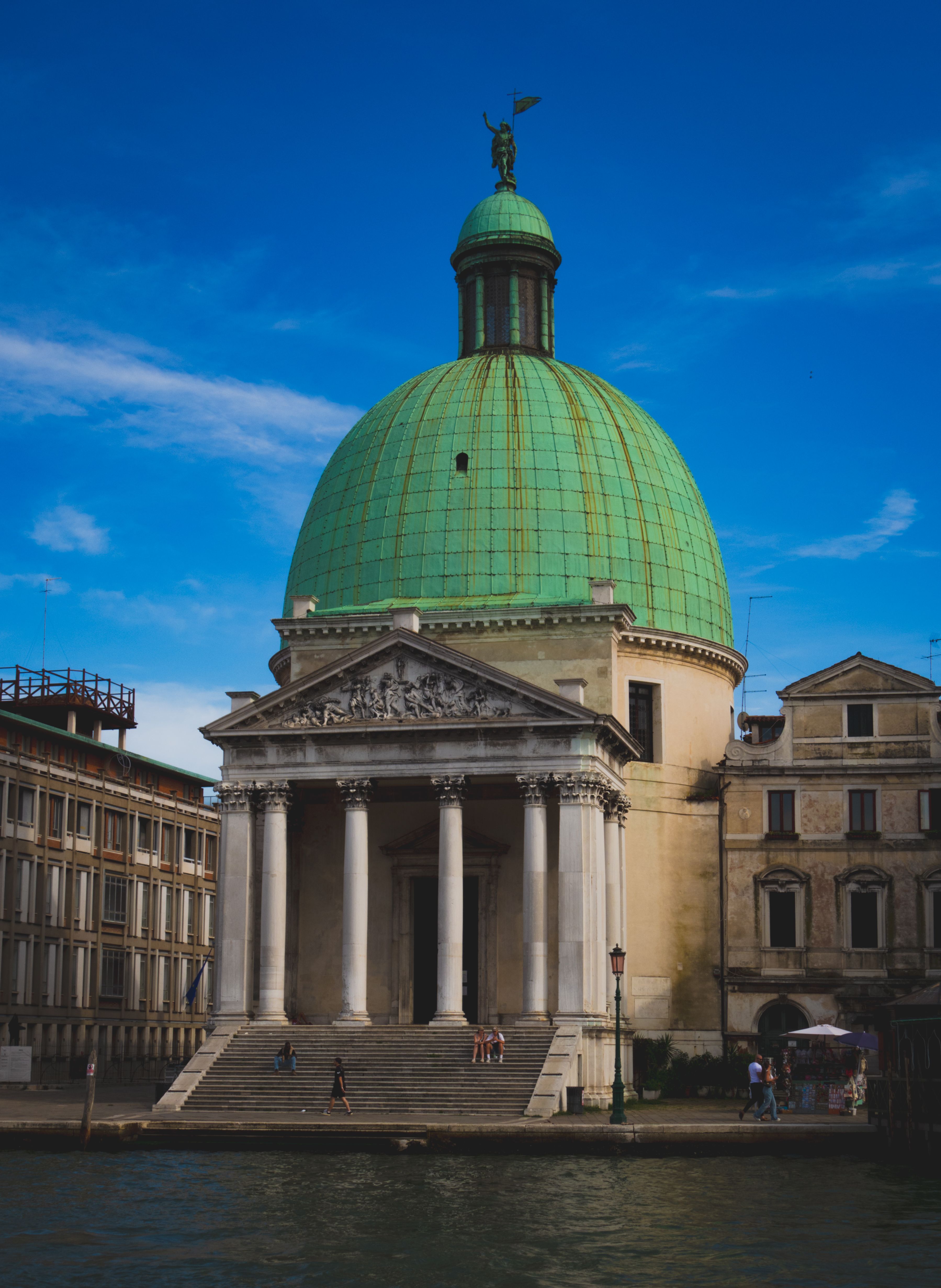 Elegant facade of San Simeone Piccolo with its iconic green dome, Venice, Italy.