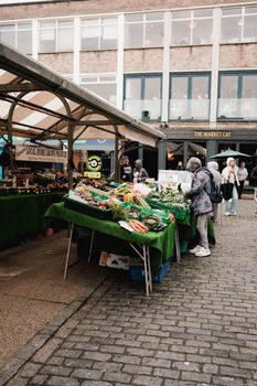 Lively outdoor farmer's market showcasing fresh local produce and bustling activity.. pexels, lively, outdoor