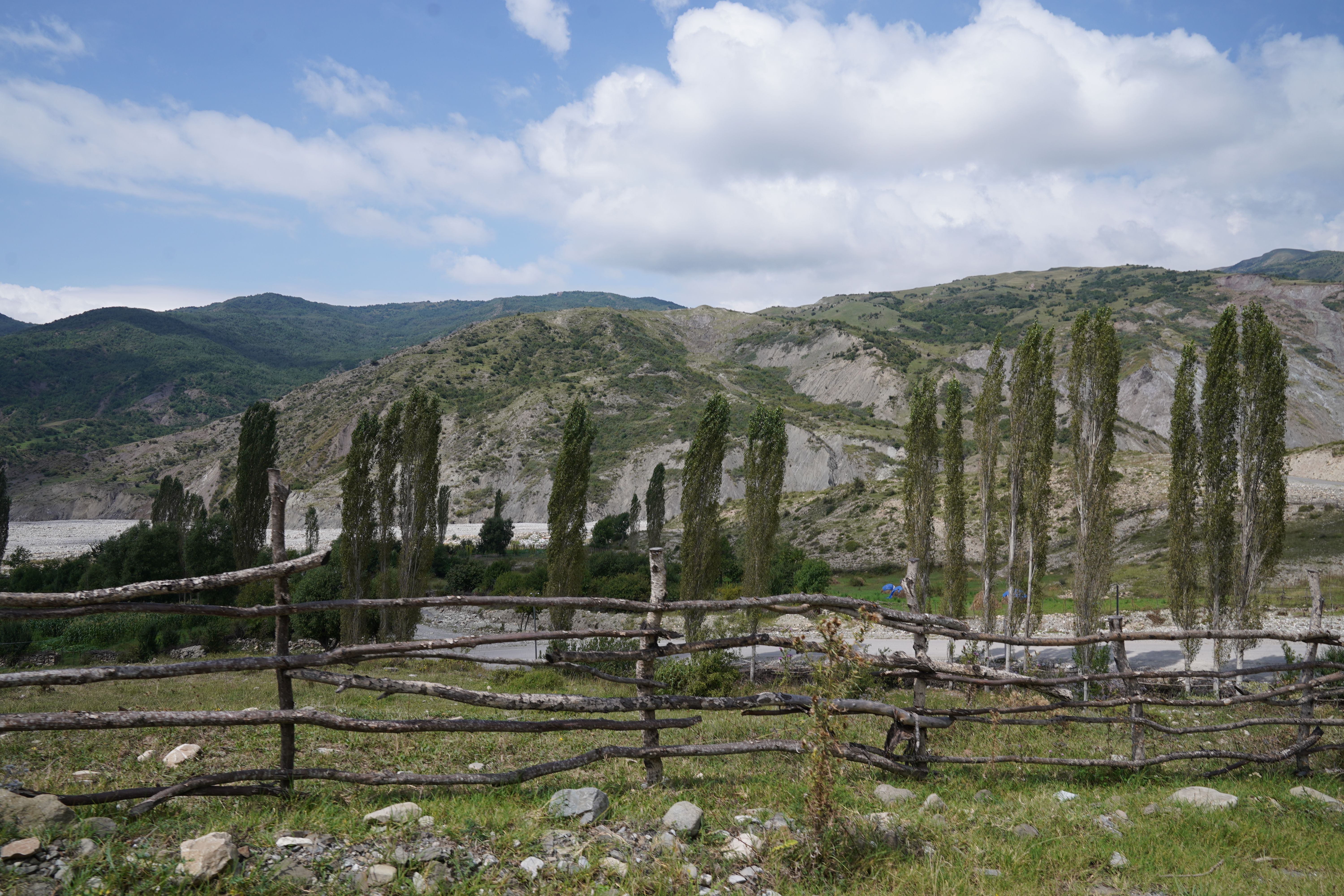 Scenic Mountain Landscape with Rustic Fence · Free Stock Photo