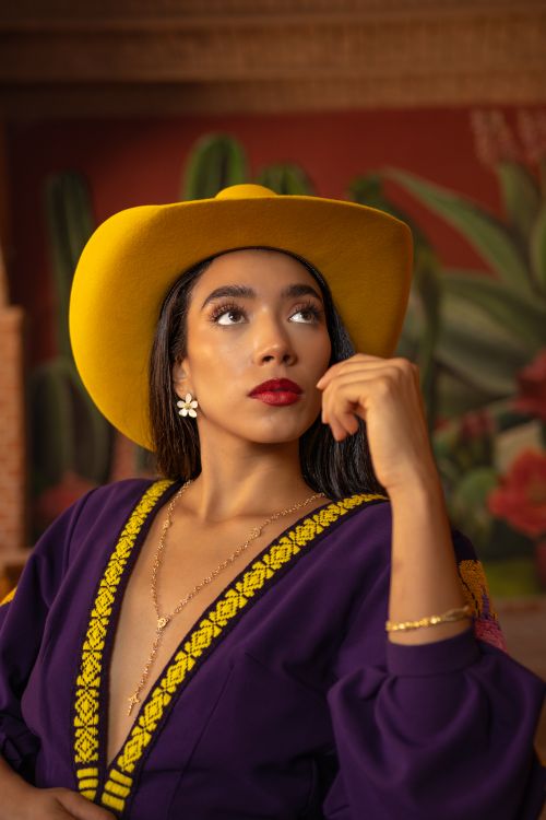 Free Elegant woman in traditional attire and yellow hat, León, Mexico. Cultural and vibrant portrait. Stock Photo