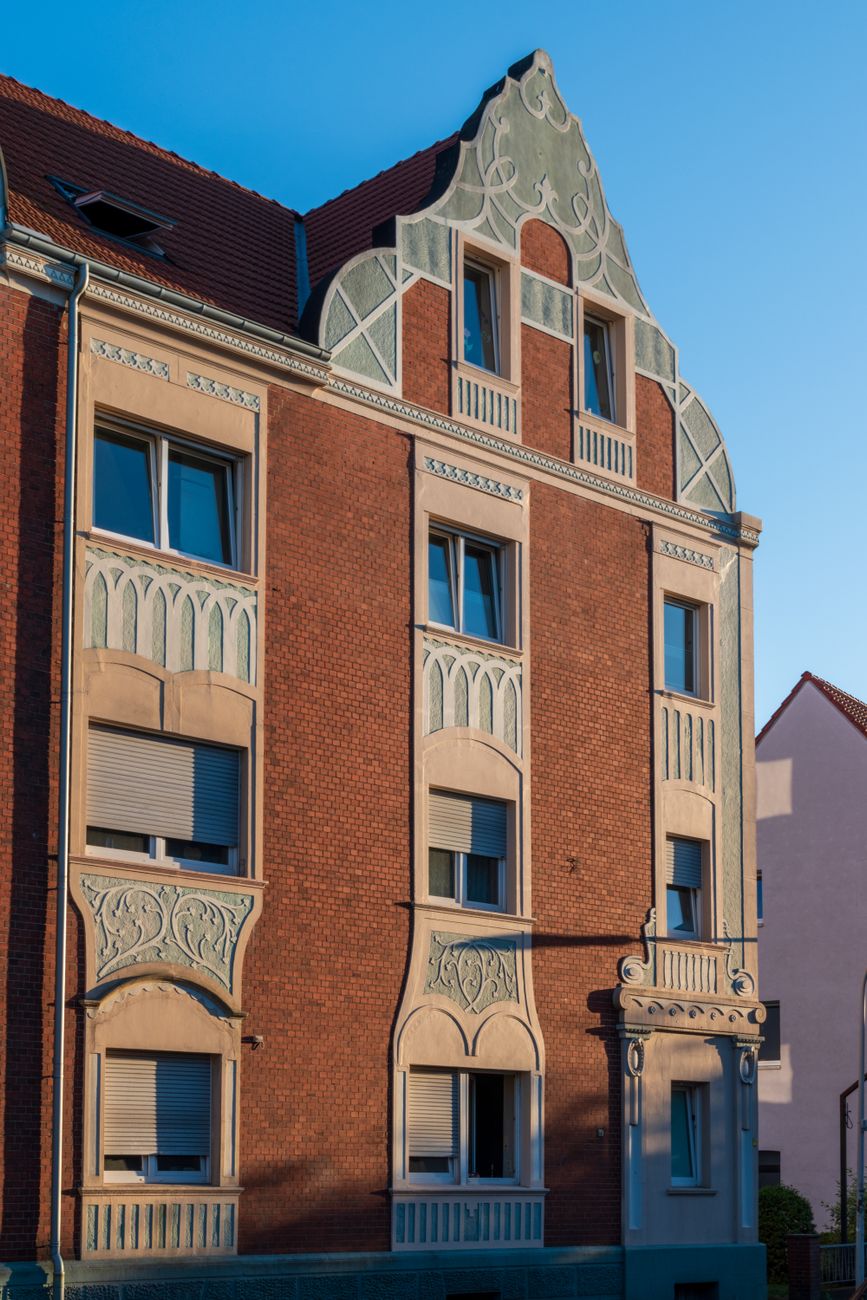 Elegant Art Nouveau facade highlighting architectural detail in warm sunlight.. elegant, nouveau, facade
